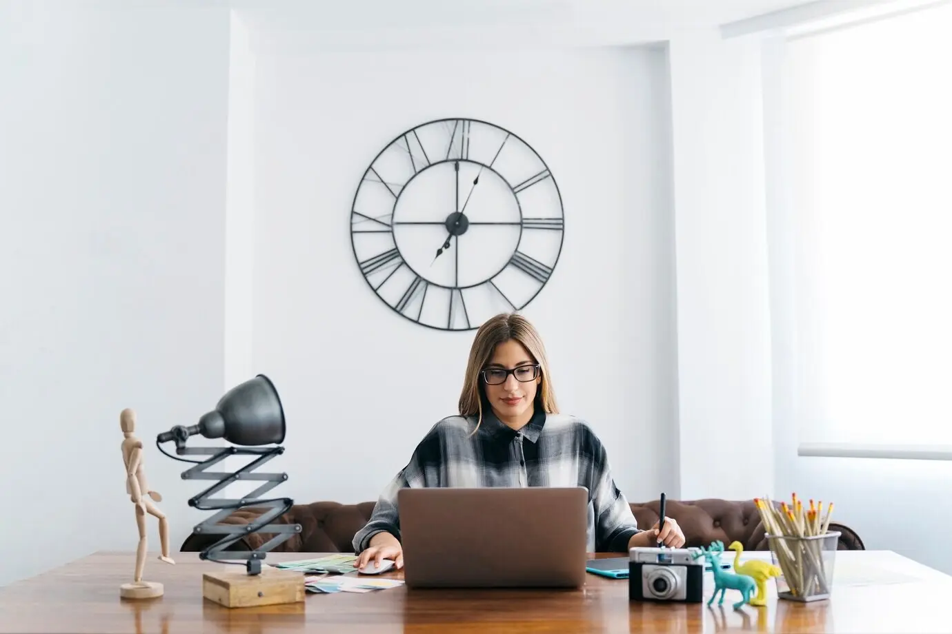 A creative graphic designer sitting at a table.